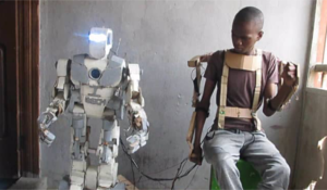 Nigerian teenager invents robot using exoskeleton remote control (Video)